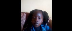 Little kenyan girl reciting SDG 4 and SDG 10